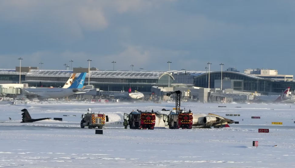 An aircraft from Delta Airlines sits upside down on the tarmac at Toronto Pearson International airport on Monday February 17, 2024.